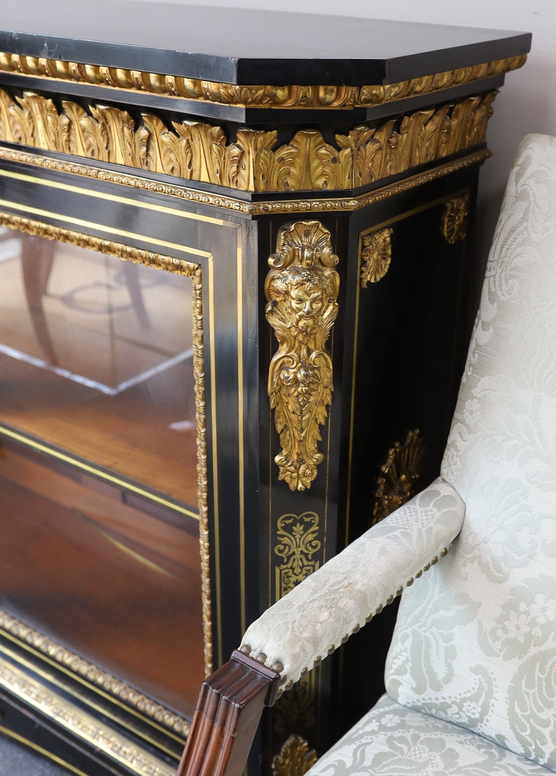 A 19th century French gilt metal mounted ebonised two door side cabinet, width 140cm, depth 38cm, height 107cm